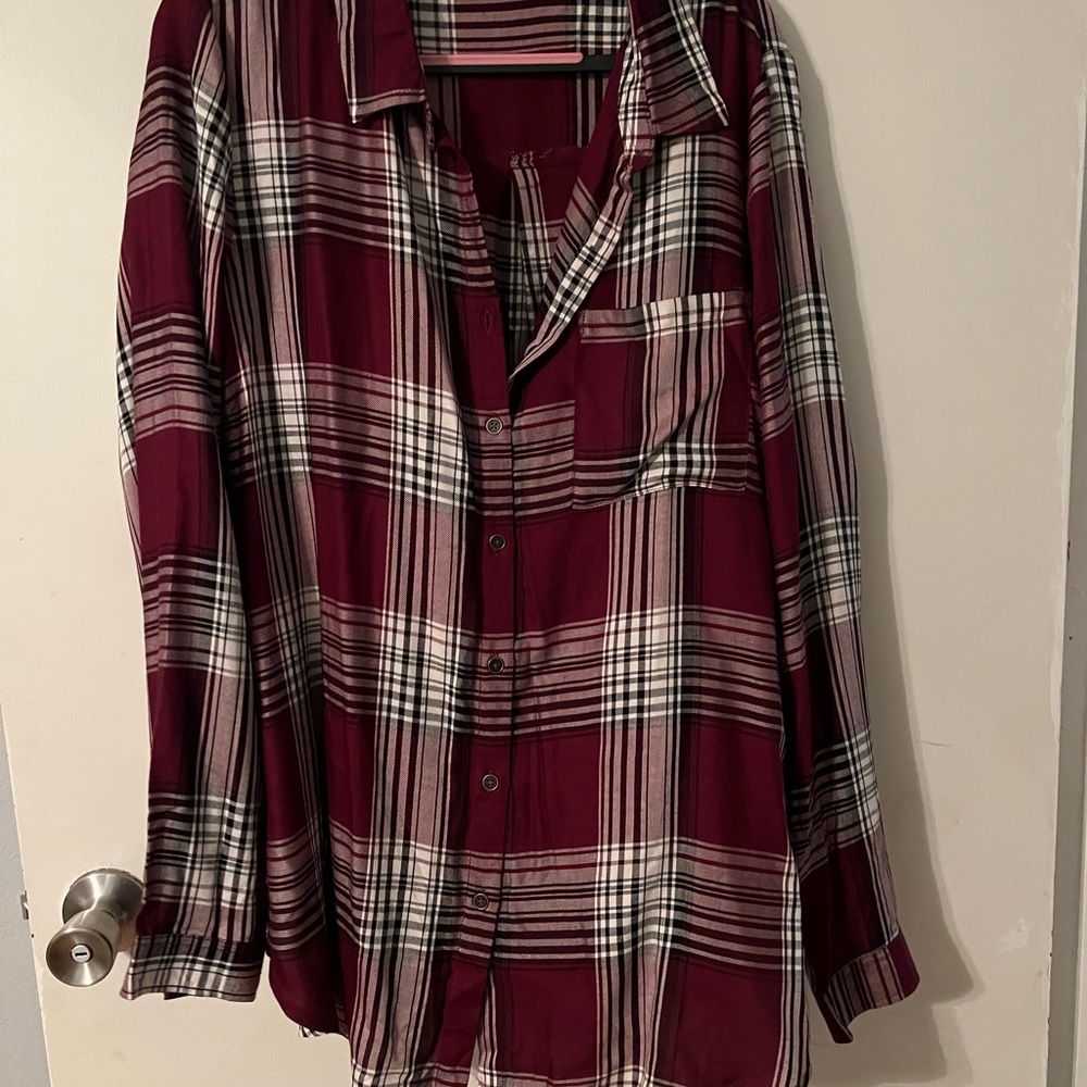 Maroon plaid button-up shirt.